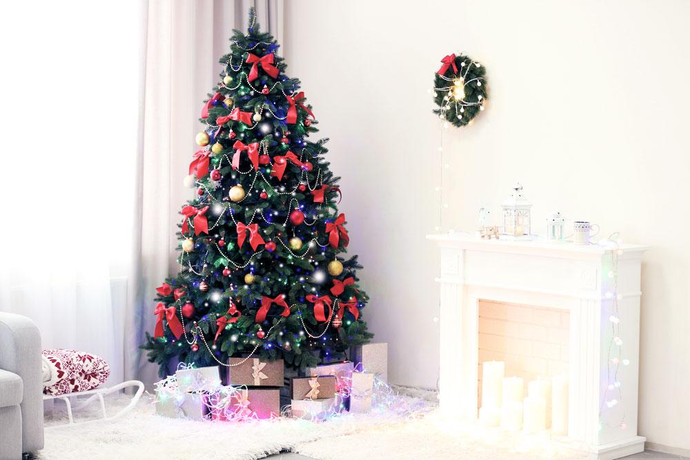 Christmas tree next to the fireplace